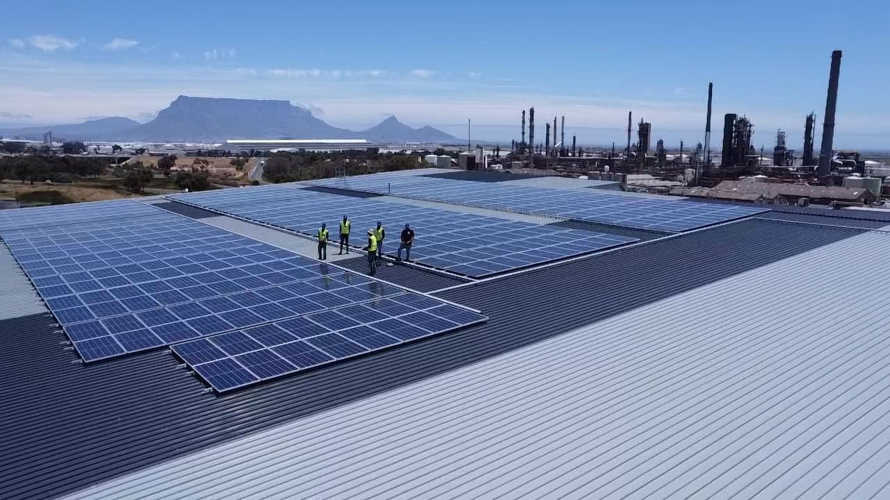 Drone view of the solar array on the ACDC building roof in Richmond Park with Table Mountain behind
